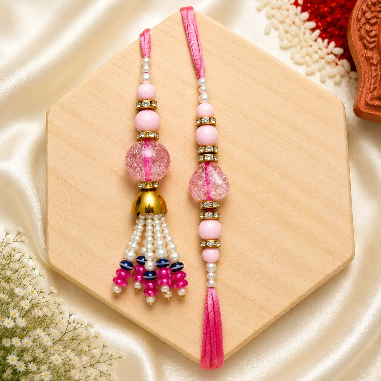 Designer Pink Pearl Bhai Bhabhi Rakhi Set with Tassel Lumba and Satin Thread for Raksha Bandhan