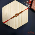 Traditional Swastik Rakhi with Beaded Detailing product image by Kashika JewelCrafts