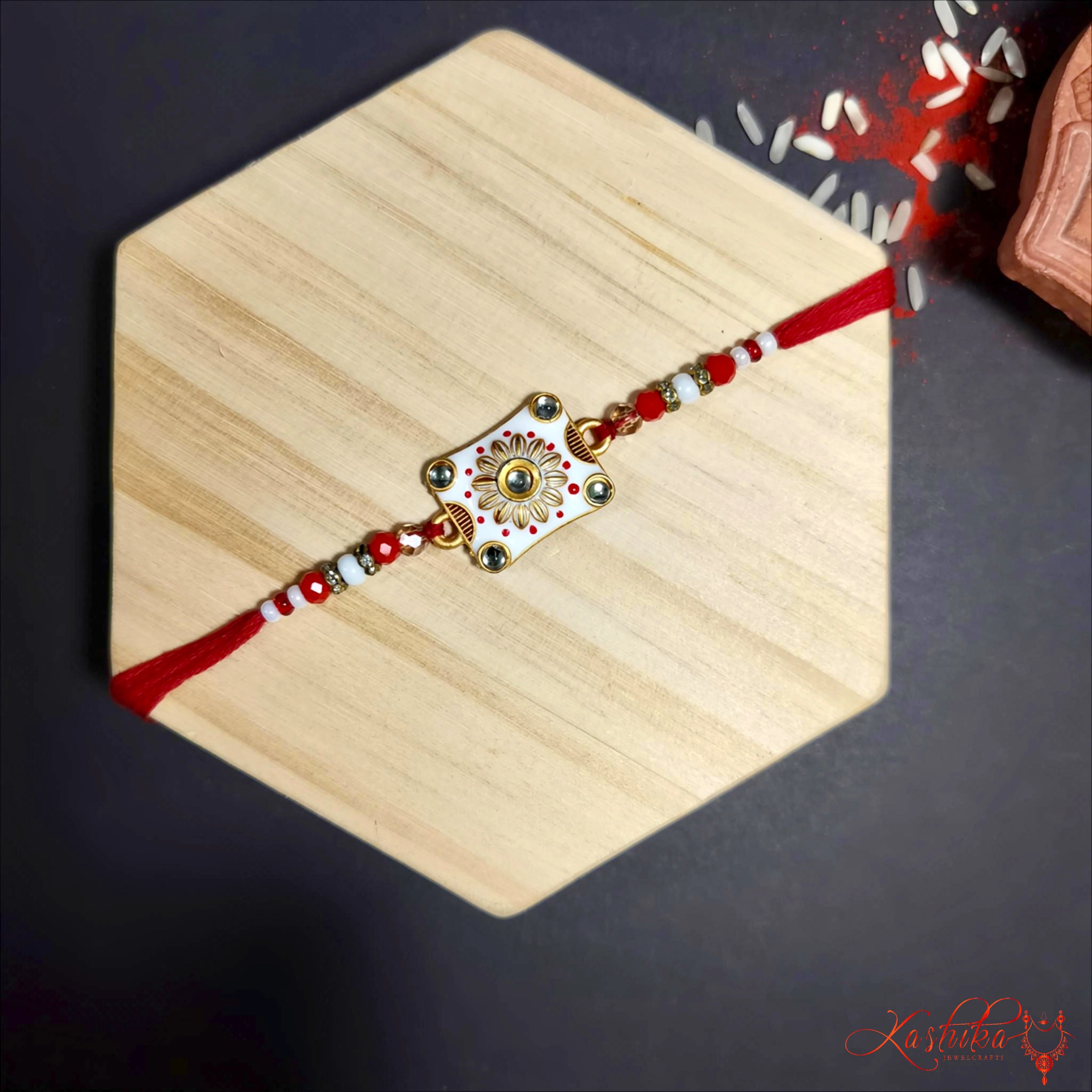 Meenakari Floral Rakhi with Beaded Thread product image by Kashika JewelCrafts