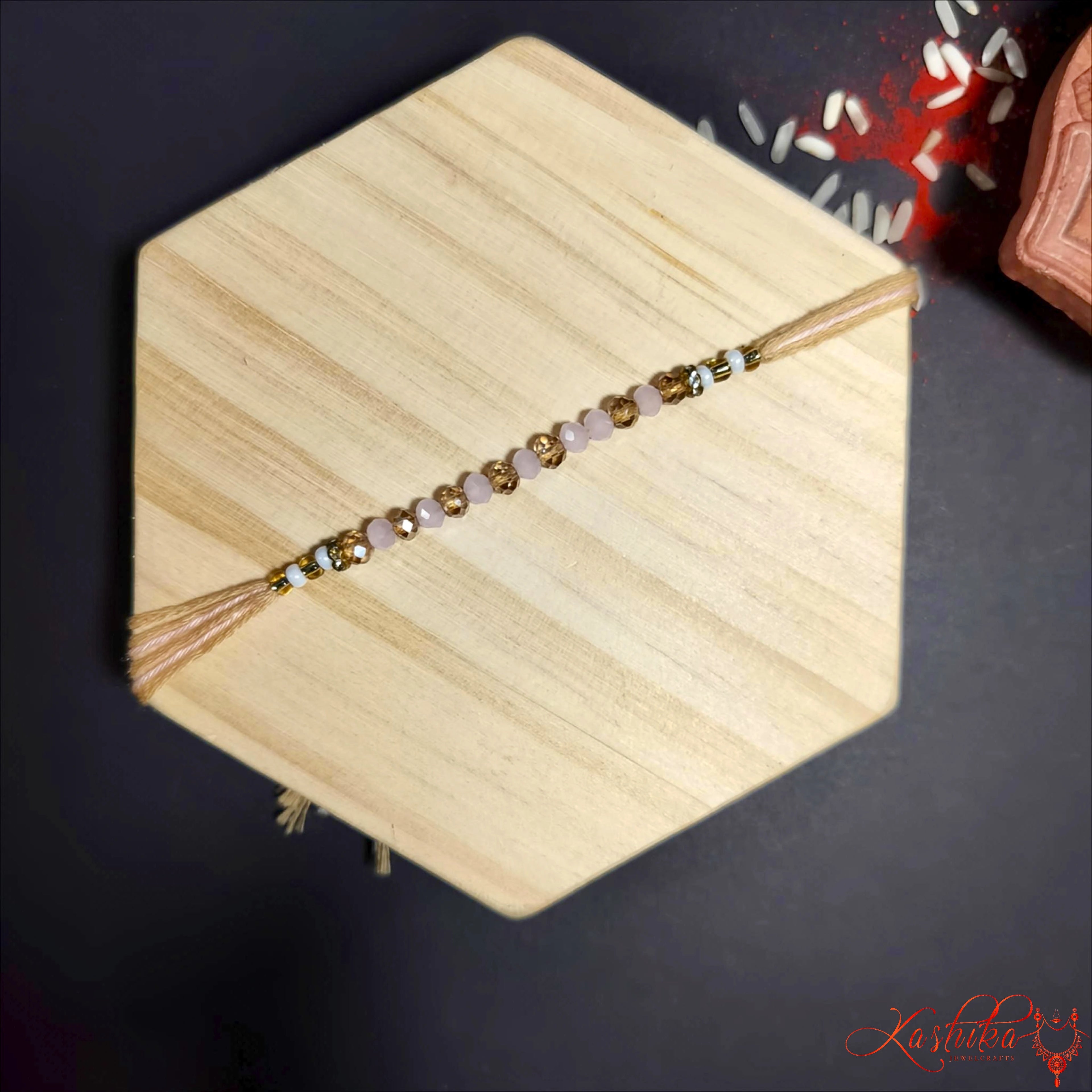 Minimalist Crystal Beaded Rakhi in Soft Gold product image by Kashika JewelCrafts