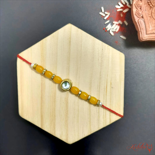 Elegant Golden Beaded Rakhi with Kundan Detailing