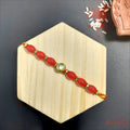 Elegant Red Beaded Rakhi with Kundan Detailing product image by Kashika JewelCrafts