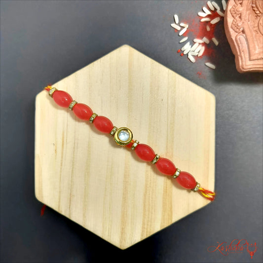 Elegant Red Beaded Rakhi with Kundan Detailing