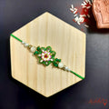 Green Meena work Rakhi with Kundan Accents product image by Kashika JewelCrafts
