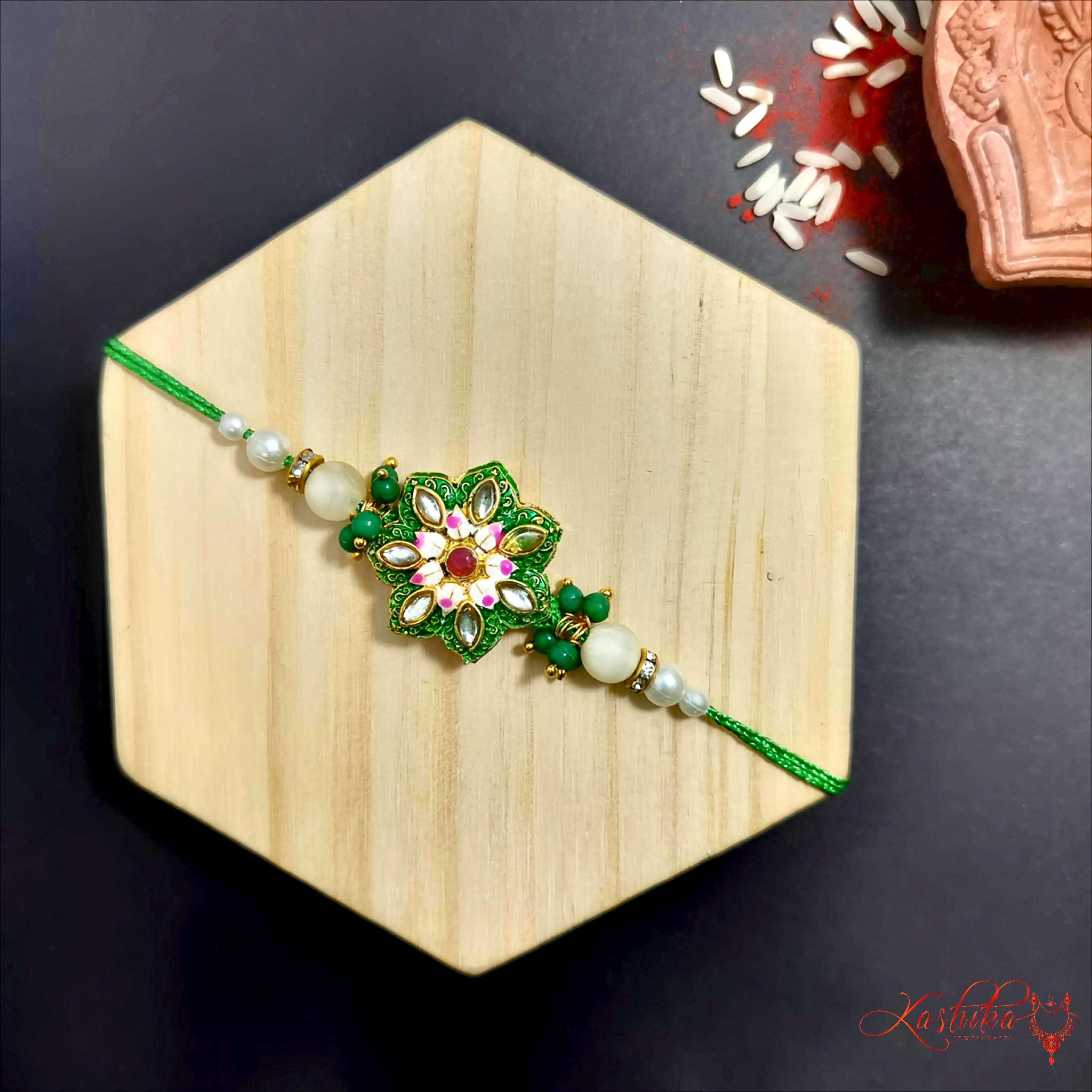 Green Meena work Rakhi with Kundan Accents product image by Kashika JewelCrafts