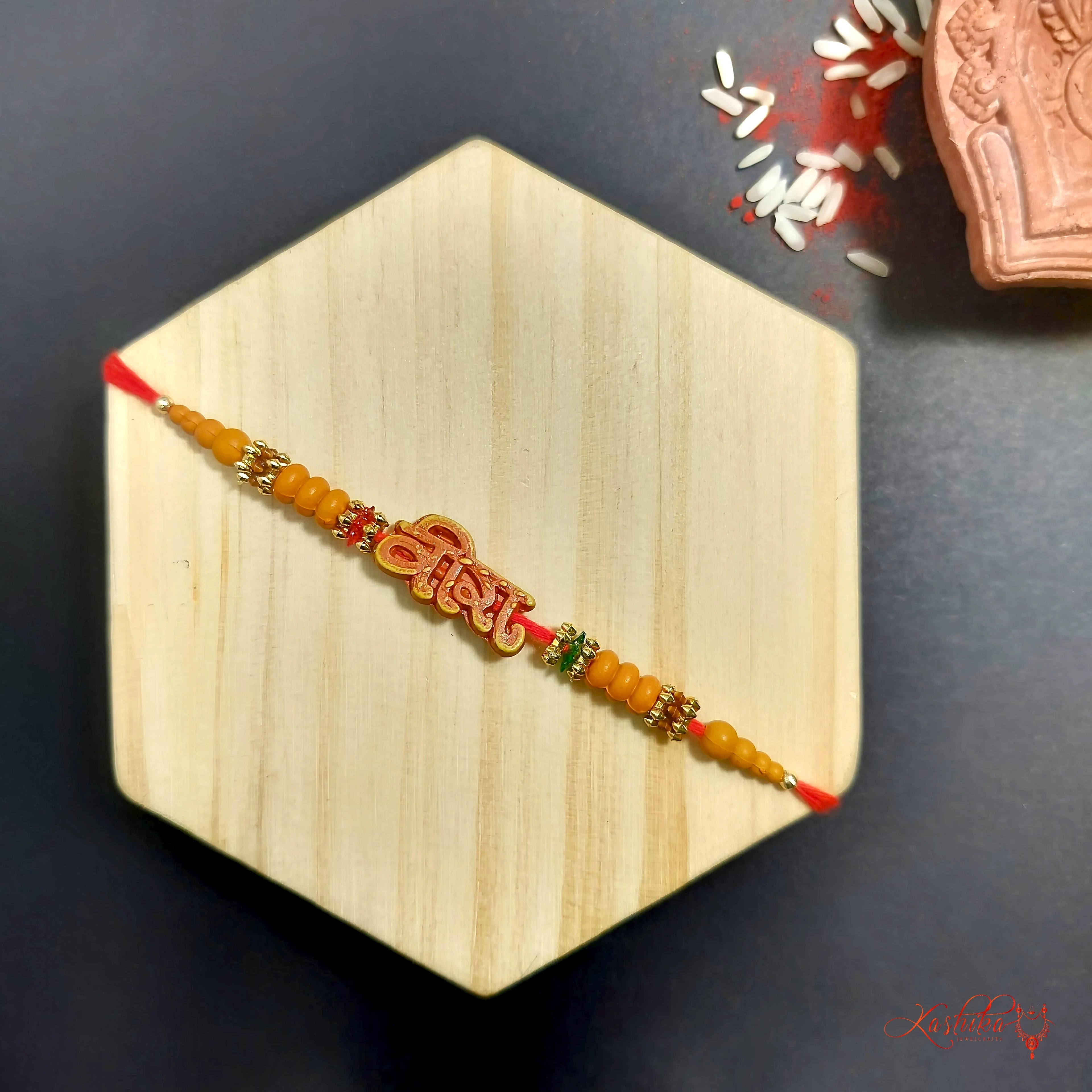 Veera Rakhi : Traditional Orange Beaded Rakhi product image by Kashika JewelCrafts