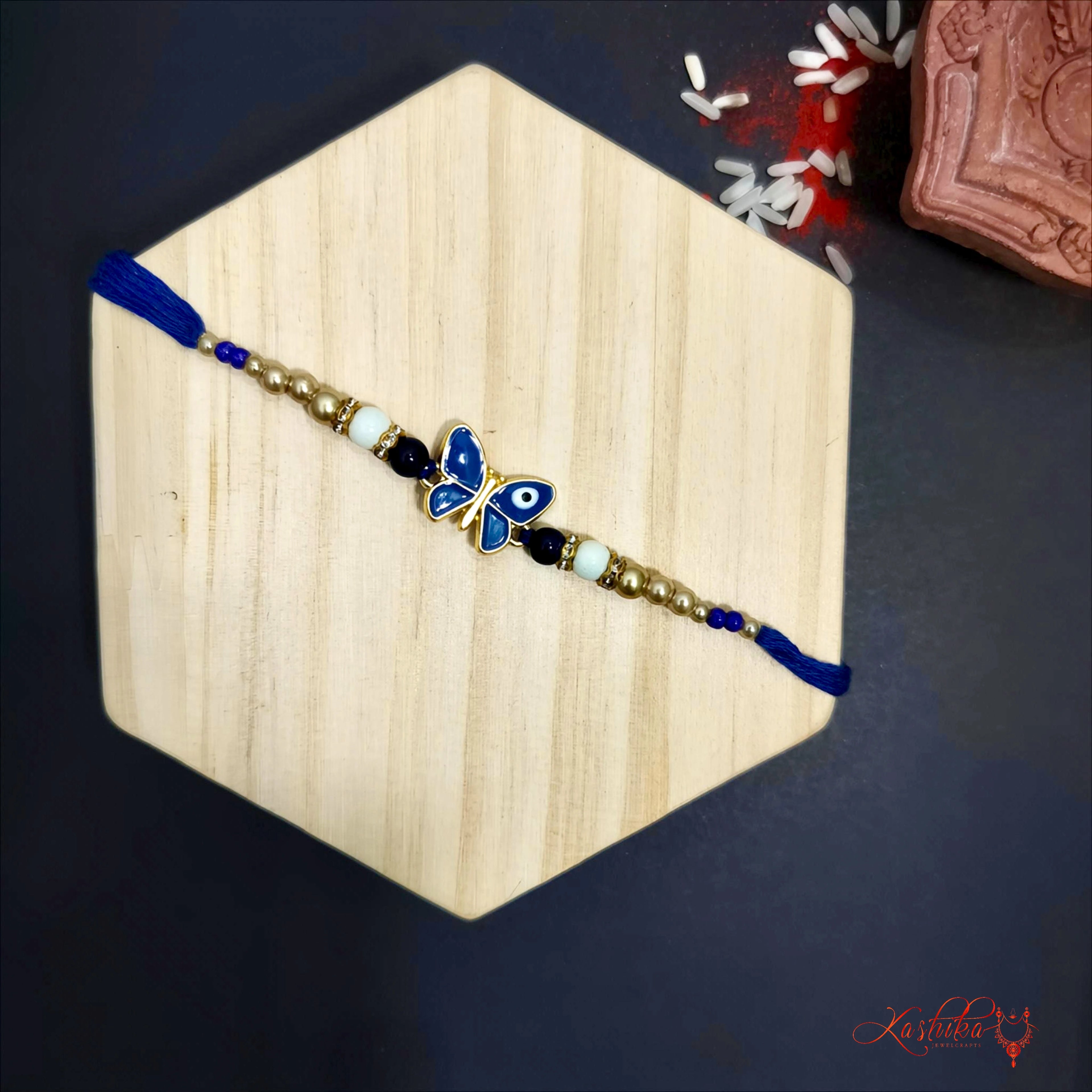 Blue Evil Eye Butterfly Rakhi - Stylish & Protective Charm for Brother product image by Kashika JewelCrafts