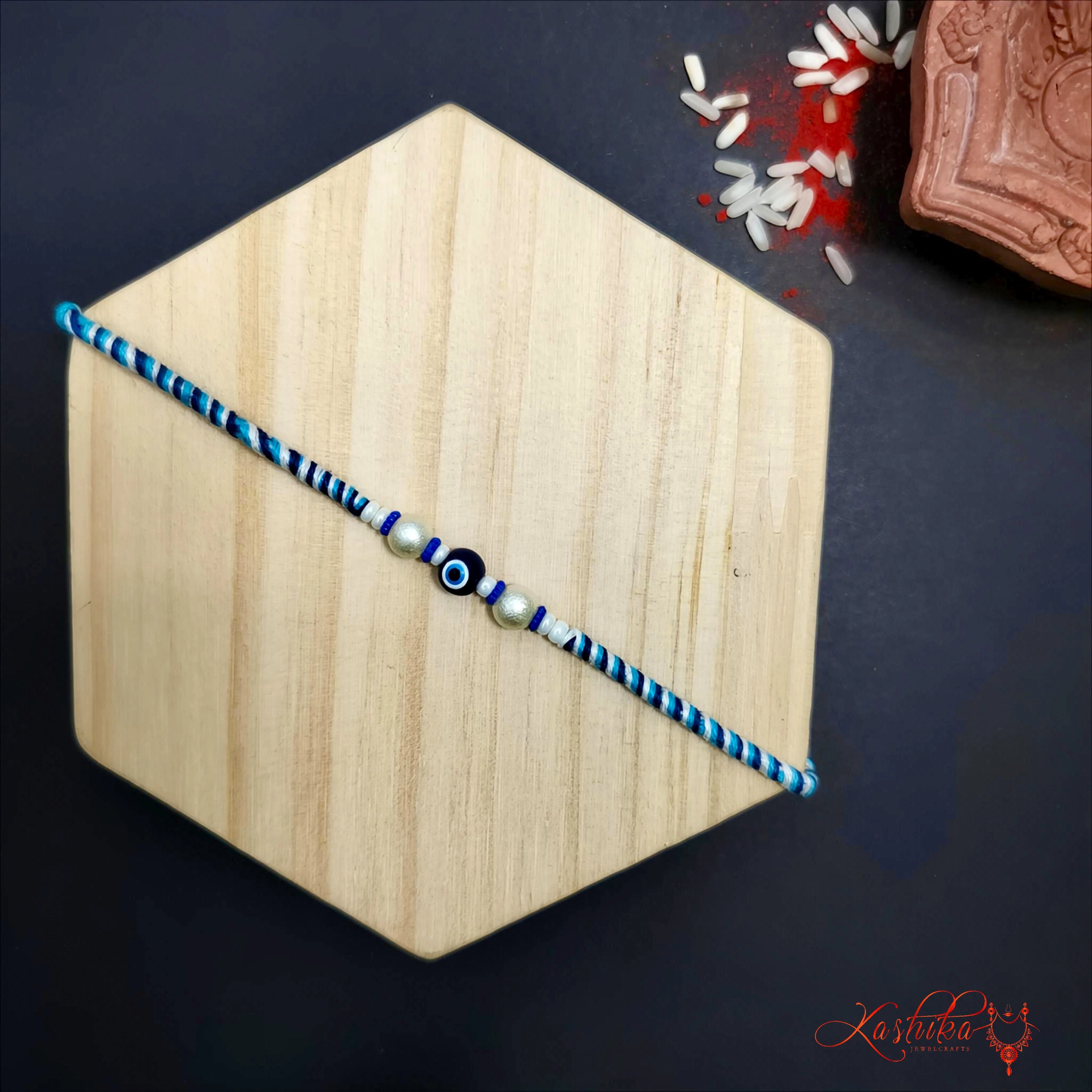 Blue Evil Eye Rakhi - Single Bead Protection Charm for Brother product image by Kashika JewelCrafts