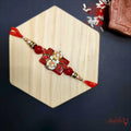 Designer Red Floral Rakhi - Elegant Raksha Bandhan thread product image by Kashika JewelCrafts