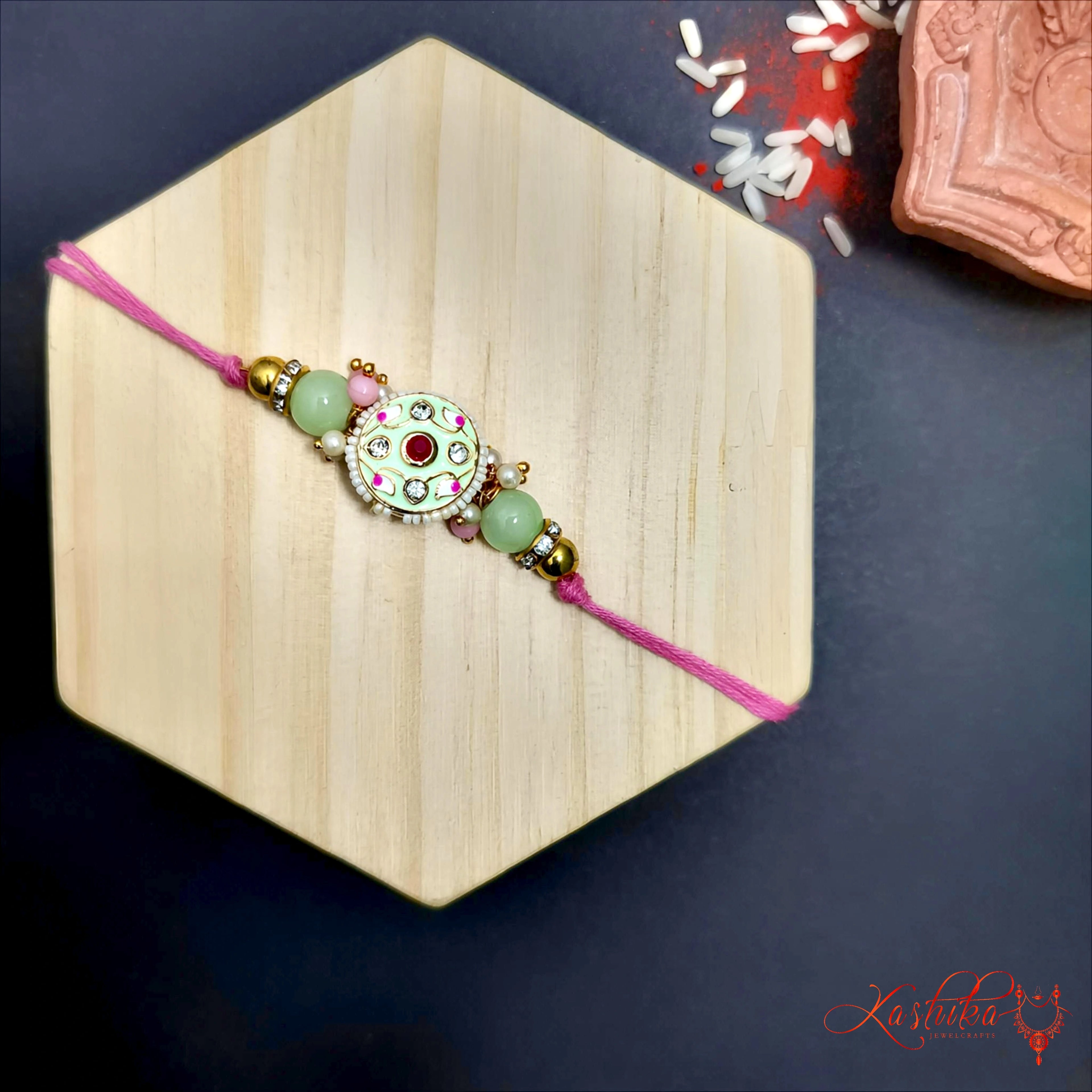 Pista Green Meenakari Rakhi - Elegant Designer Raksha Bandhan product image by Kashika JewelCrafts