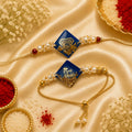 Royal Blue Super Bro & Pyari Bhabhi Resin Bhai Bhabhi Rakhi Set featuring gold foil resin charms, pearl embellishments, adjustable designer Lumba, and matching Bhai Rakhi by Kashika JewelCrafts.