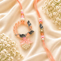 Peach Crystal Oxidized Leaf Bhai Bhabhi Rakhi Set featuring a designer Bhai Rakhi, floral pearl tassel Lumba, and handcrafted peach crystal beads by Kashika JewelCrafts.