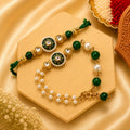 Handmade Green Pearl Kundan Bhai Bhabhi Rakhi Set featuring a round green enamel kundan centerpiece, pearl border, green beads, pearl accents, and a matching designer Lumba with pearl chains by Kashika JewelCrafts.