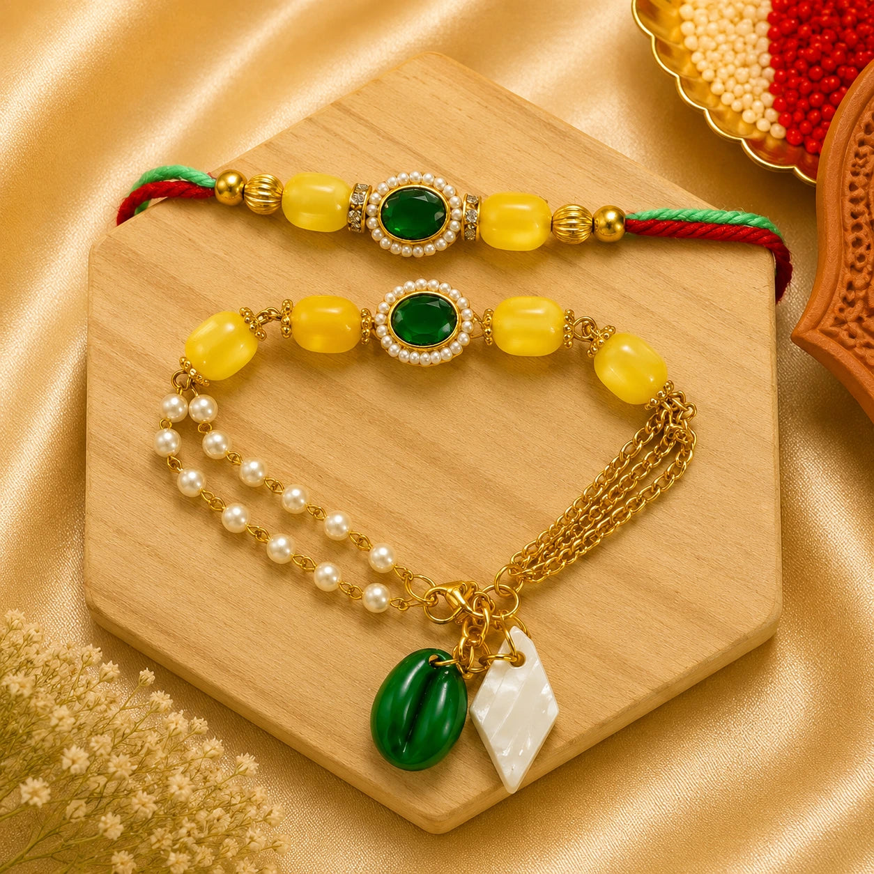 Handmade Emerald Pearl Bhai Bhabhi Rakhi Set featuring an emerald green oval stone centerpiece, yellow beads, pearl detailing, and a matching designer Lumba bracelet with pearl chains by Kashika JewelCrafts
