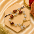 Handmade Brown Pearl Bhai Bhabhi Rakhi Set featuring wooden-textured beads, pearl accents, neutral beads, and a matching designer Lumba Rakhi by Kashika JewelCrafts.
