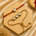Handmade Classic Kundan Bhai Bhabhi Rakhi Set featuring a round Kundan stone Rakhi with a matching adjustable gold-finish Lumba bracelet by Kashika JewelCrafts.