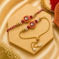 Handmade Pink Kundan Bhai Bhabhi Rakhi Set featuring a pink and orange Kundan rakhi with crystal beads, pearl accents, and an adjustable bracelet by Kashika JewelCrafts.