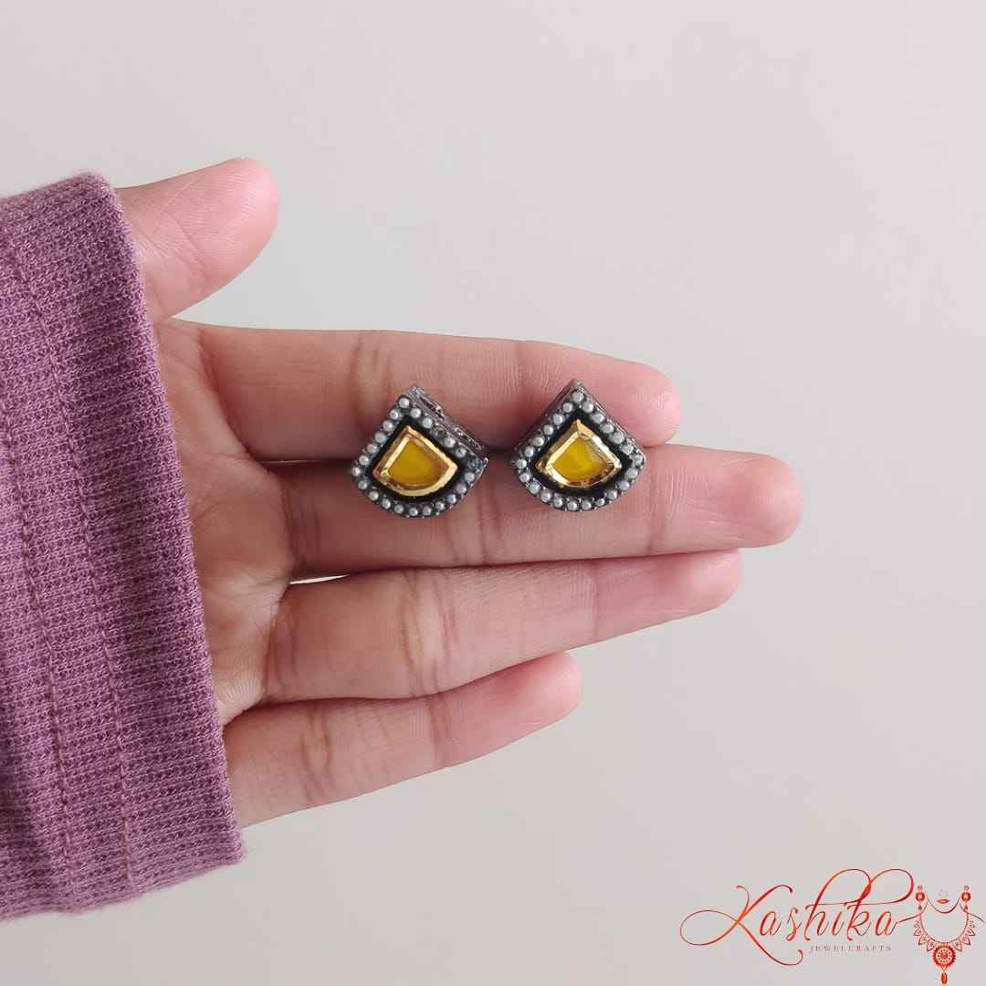 Oxidised stud earrings with teardrop-shaped yellow gemstone with golden and silver detailing - Kashika JewelCrafts