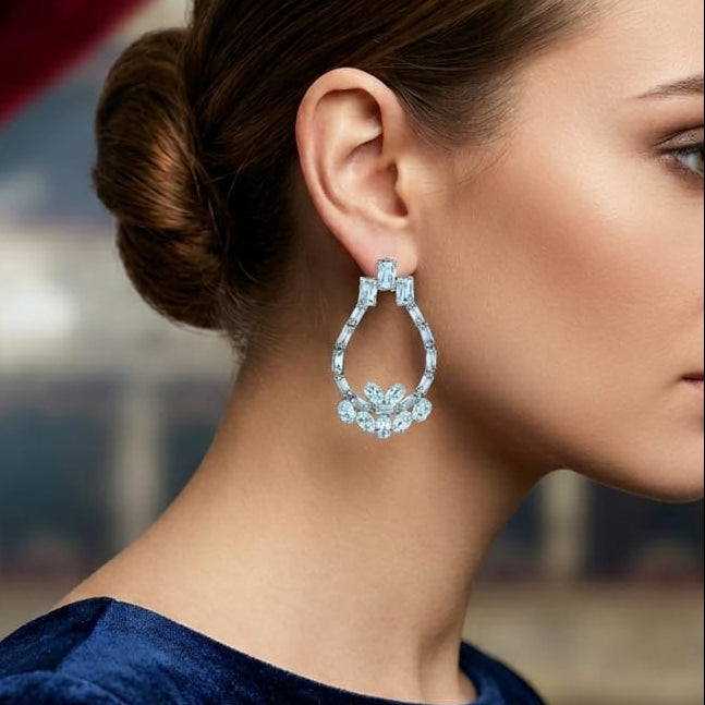 Close-up of a woman wearing a blue earring with a blurred background