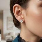 Close-up of a person wearing a diamond earring in a living room setting