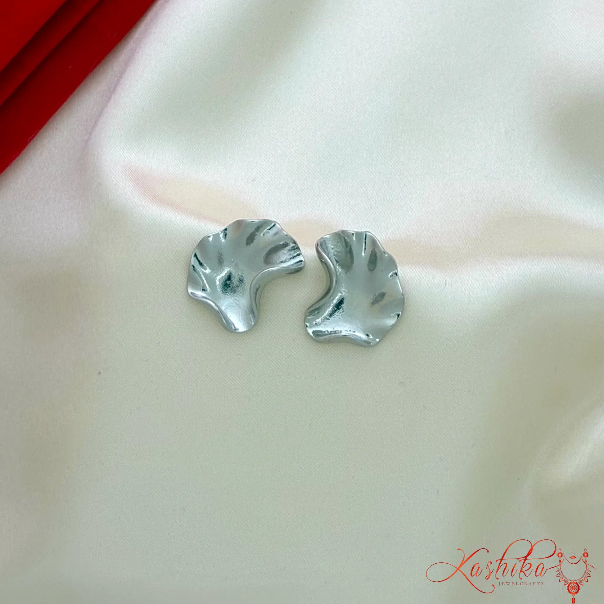 Abstract irregular silver stud earrings for women with modern minimalist design