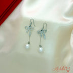 Elegant rhinestone bow pearl dangler earrings for women with ribbon design and pearl drop
