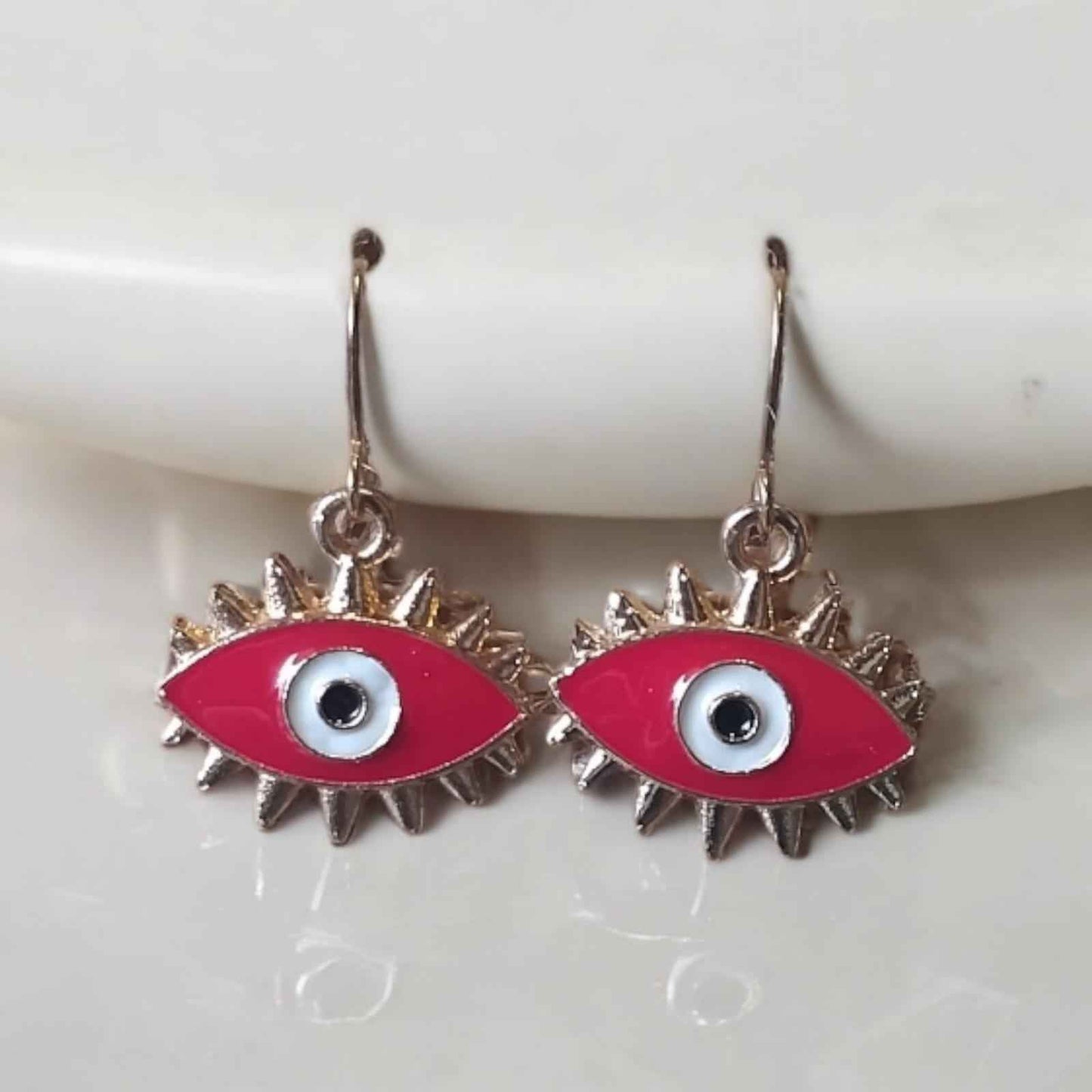 Red evil eye drop earrings for women with sunburst spike design